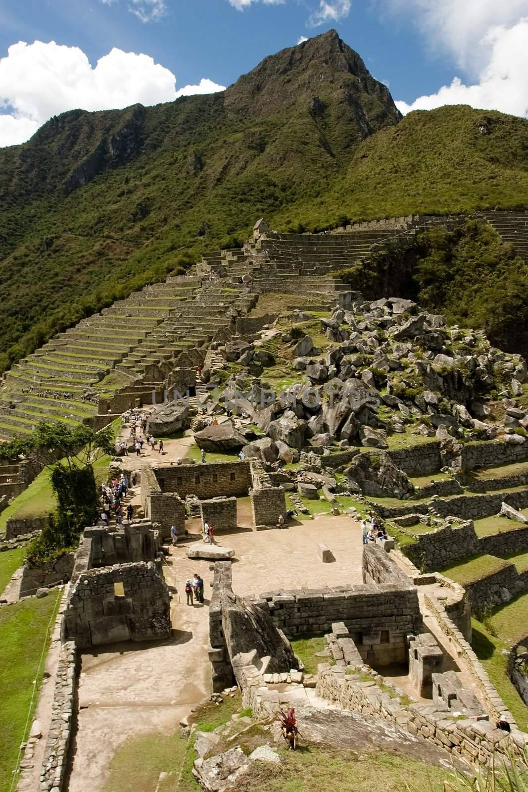 Machu Picchu  is a pre-Columbian Inca site located 2,400 meters (7,875 ft) above sea level. It is situated on a mountain ridge above the Urubamba Valley in Peru, which is 80 km (50 mi) northwest of Cusco. Often referred to as "The Lost City of the Incas", Machu Picchu is probably the most familiar symbol of the Inca Empire.