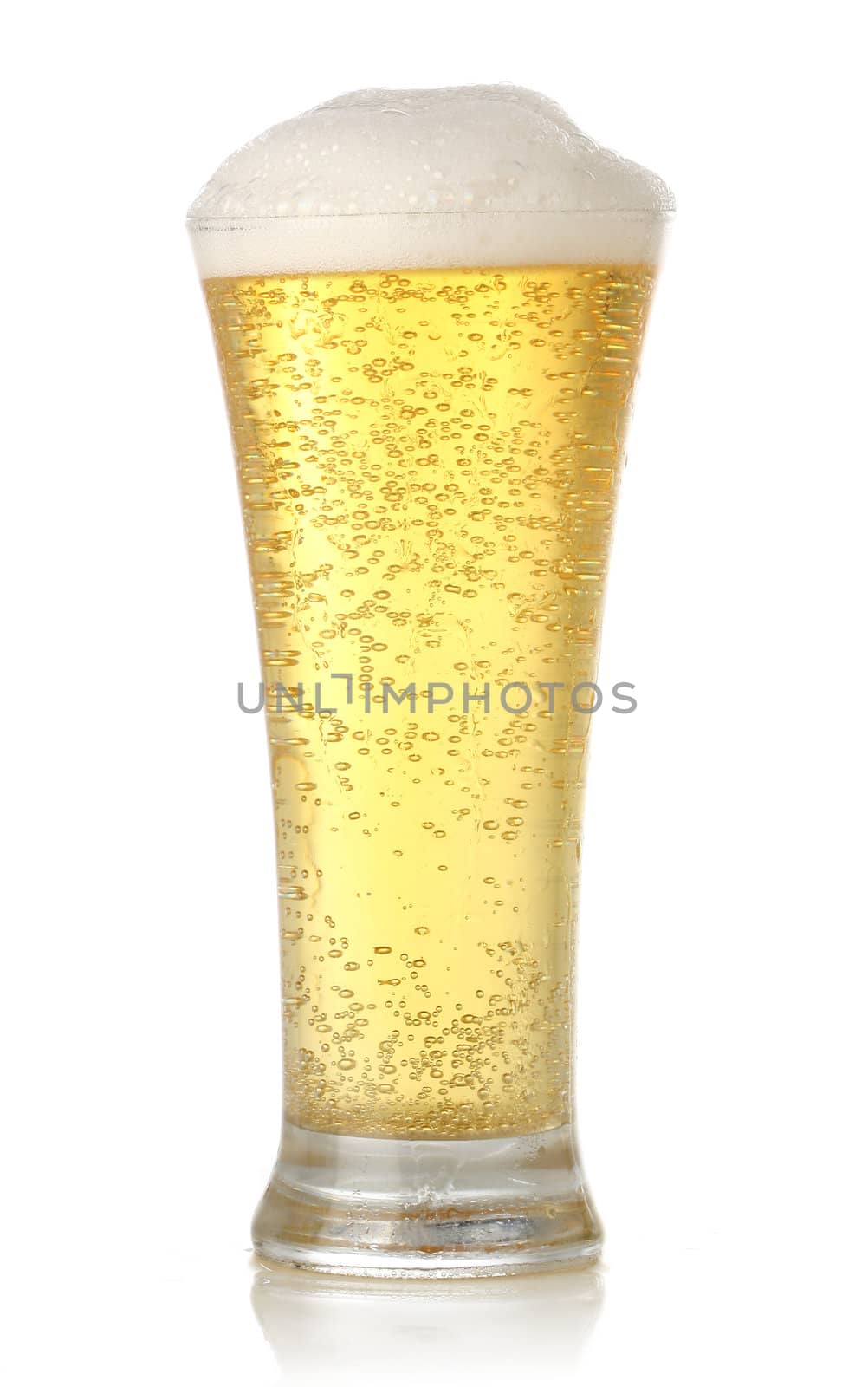Glass of cold and fresh golden beer, over white background