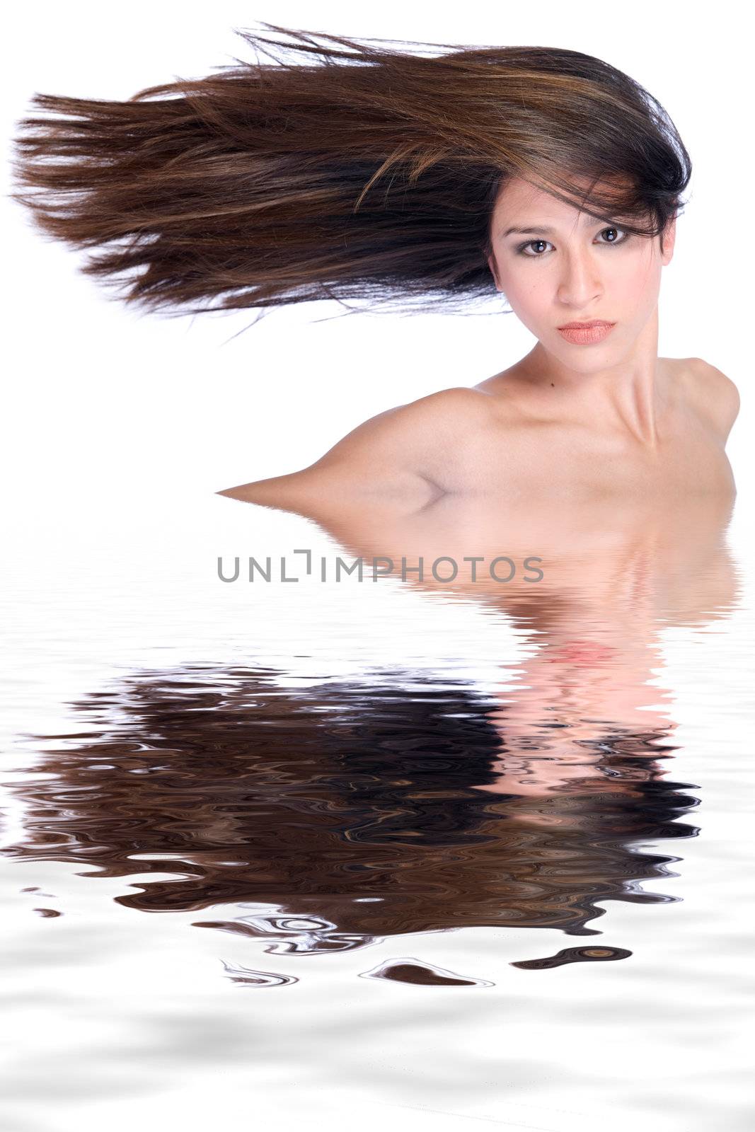 Studio portrait of a beautiful mixed race, vietnamese girl with very long hair to one side
