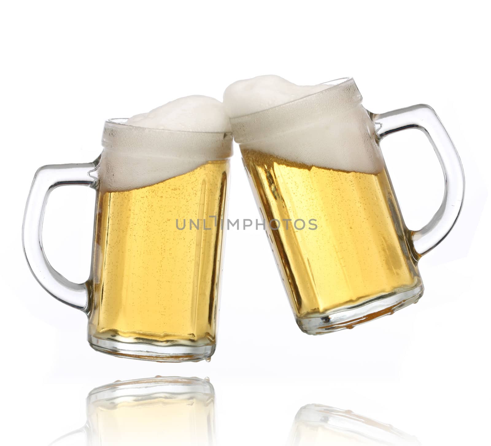 Pair of beer glasses making a toast. Beer splash
