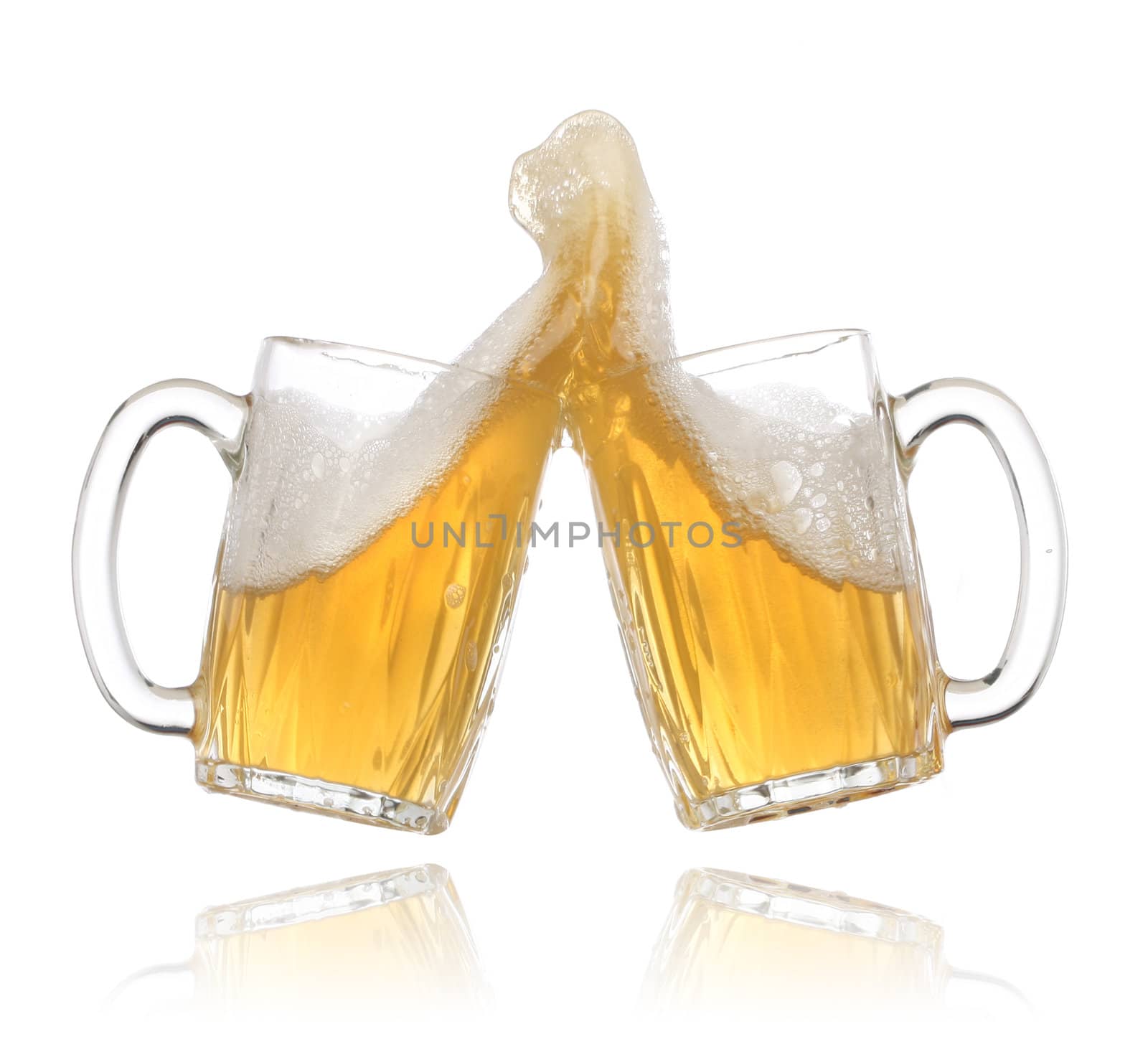 Pair of beer glasses making a toast. Beer splash