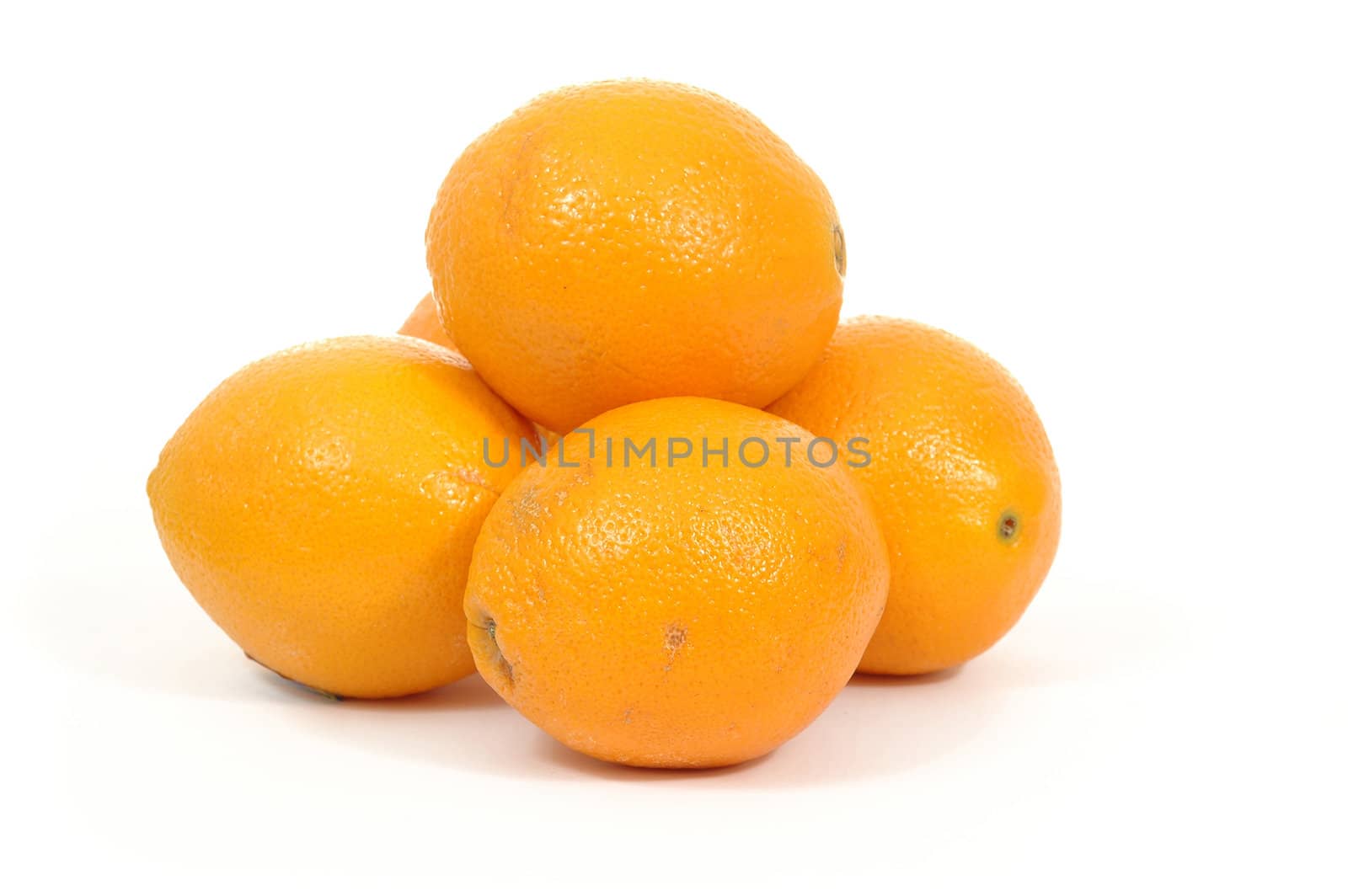 Pile of oranges. The oranges are taken on a white background.