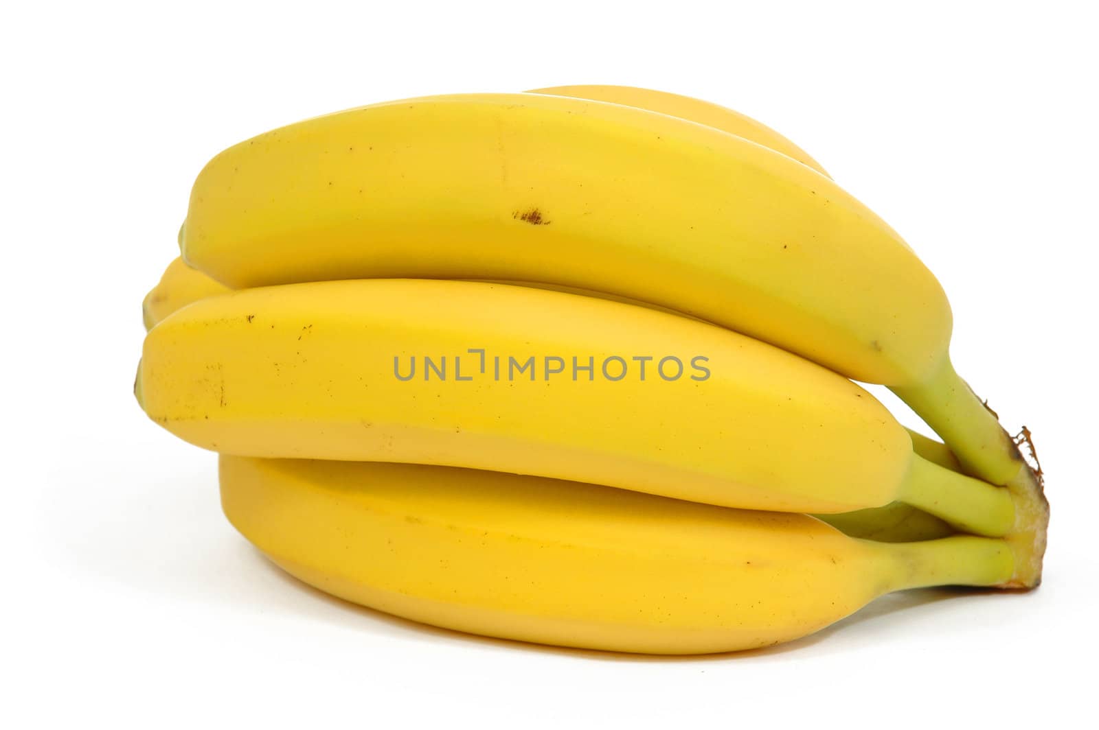 Yellow bananas in a bunch. The bananas are taken on a clrean white background.