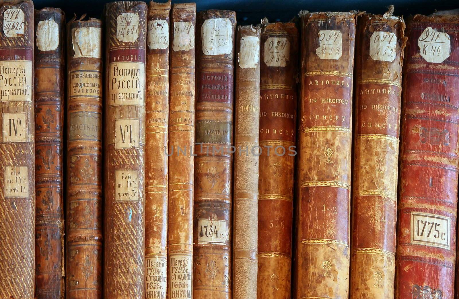 Row of old  books cover spines by fotosergio