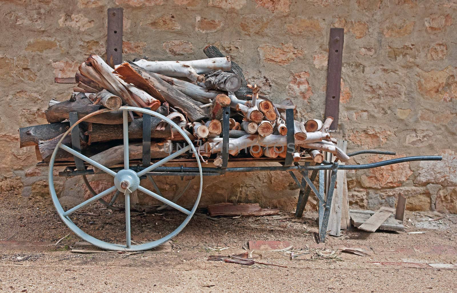 old vintage cart loaded up with wood