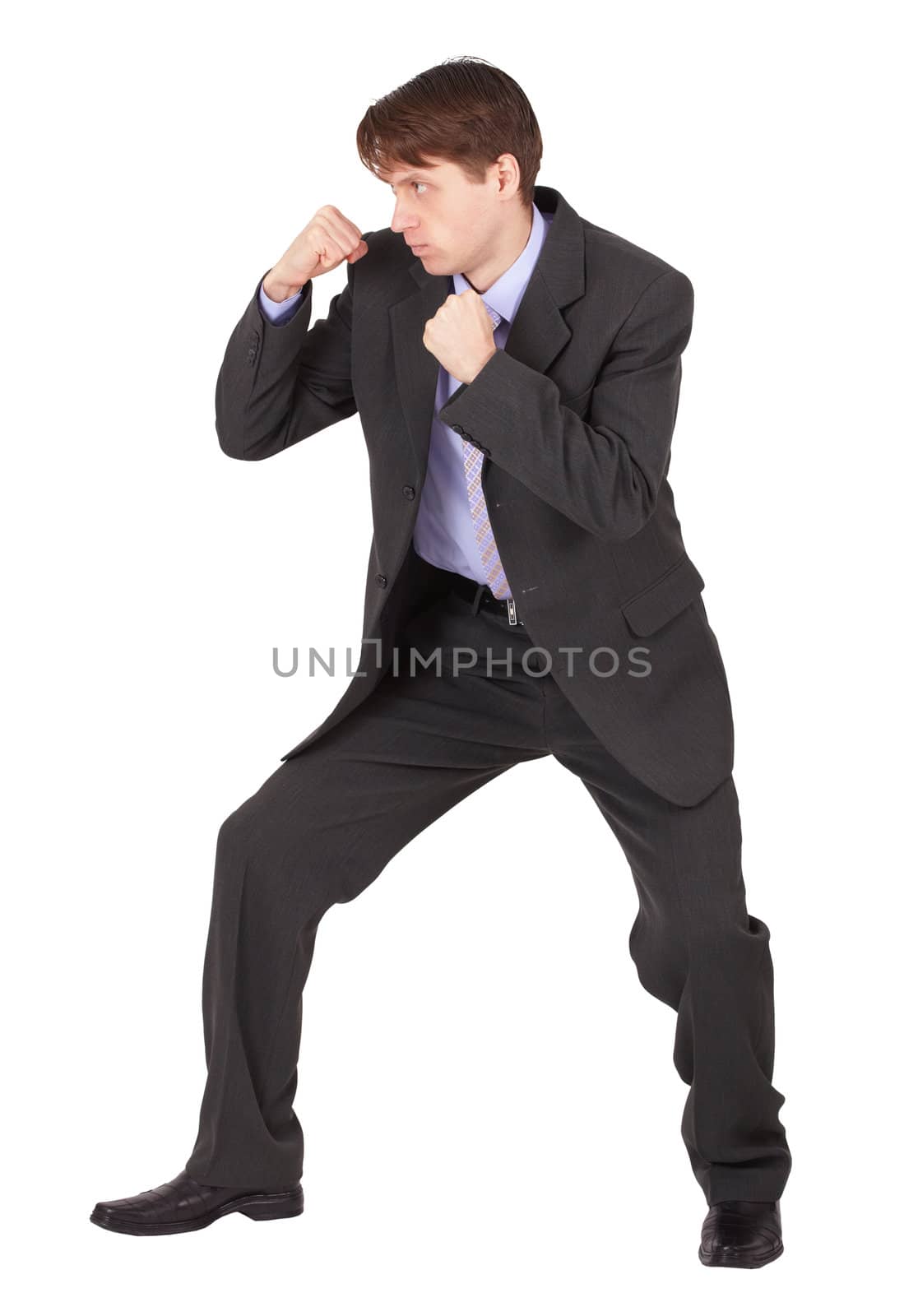 Businessman  in boxing fighting stance against a white background