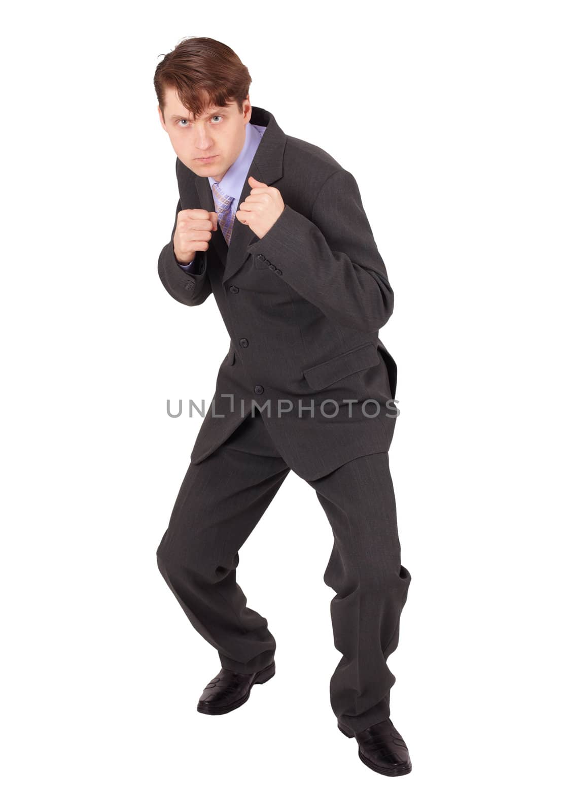 Young man in boxing fighting stance against a white background