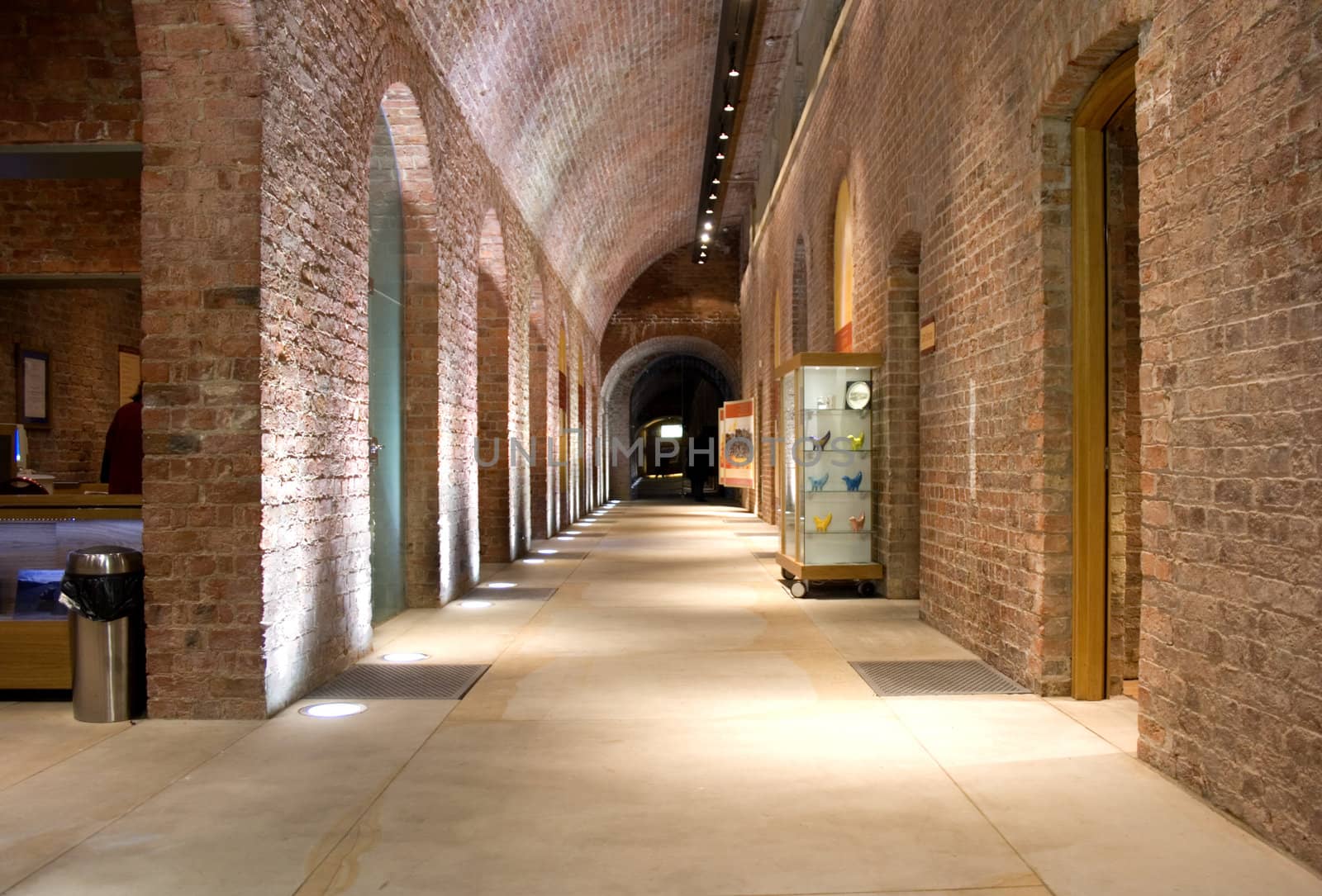 Looking down corridor in ancient building (1854) with arched doorways