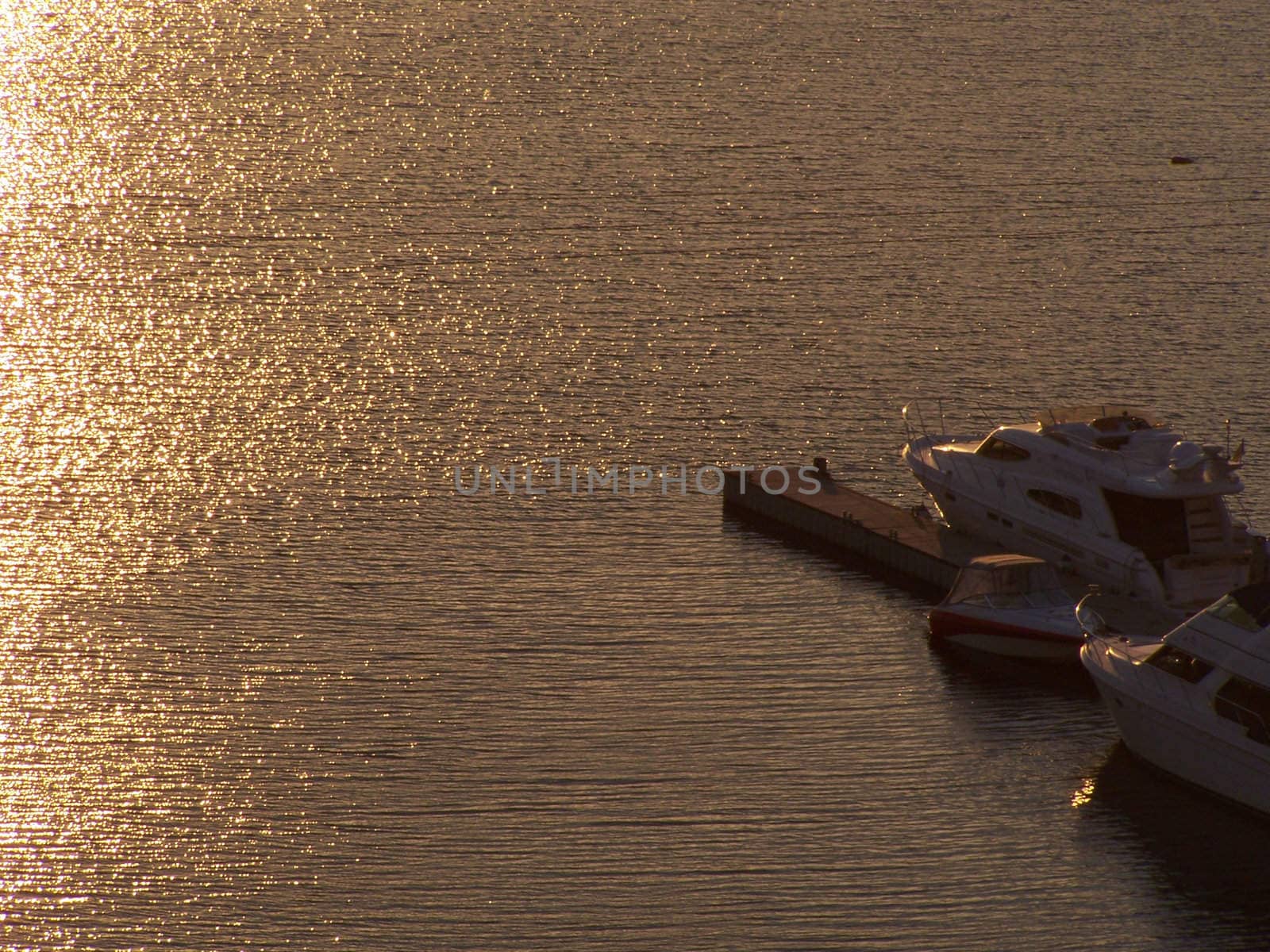 Boats during sunset by Lessadar