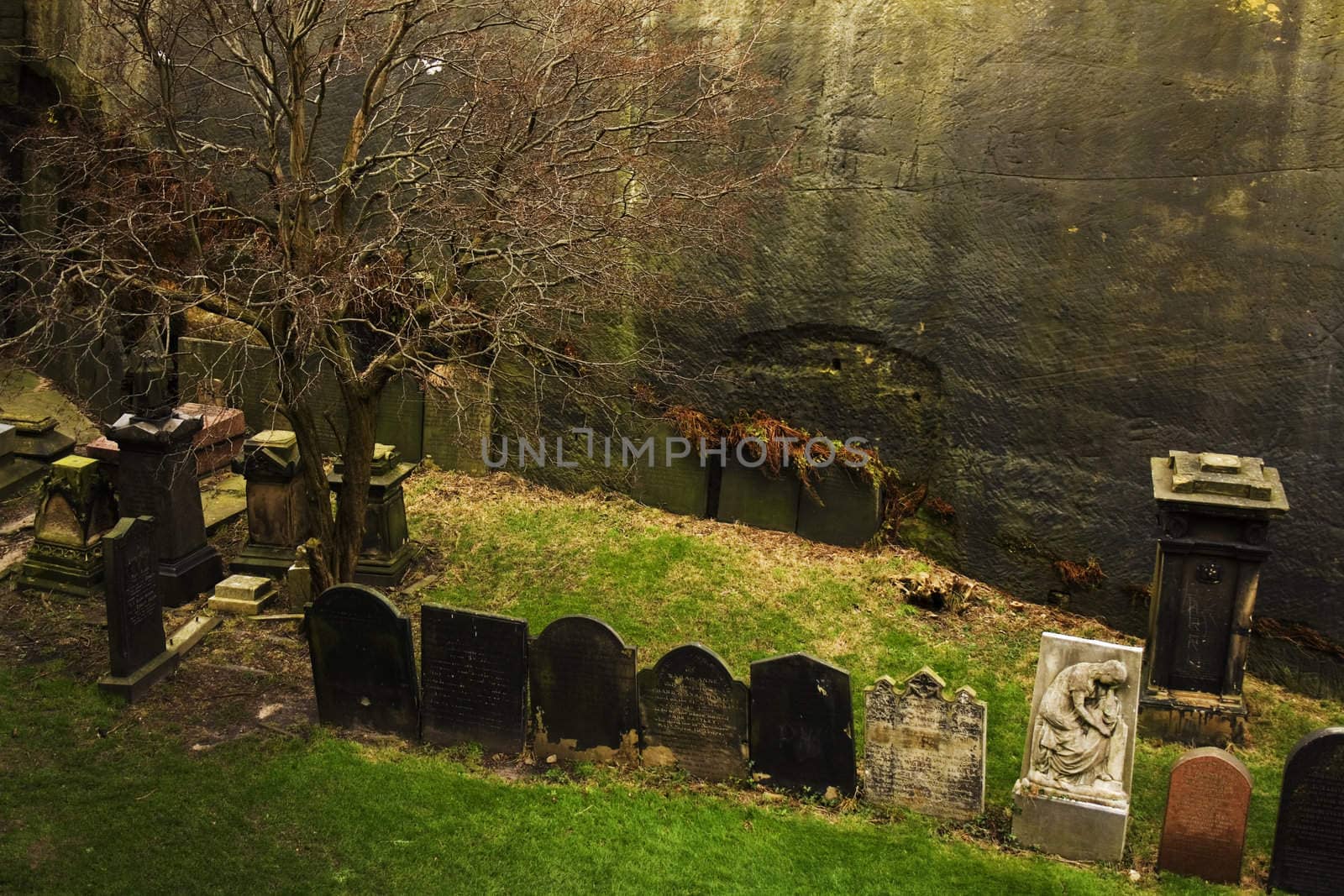 Row of very old tombstones in a cemetery