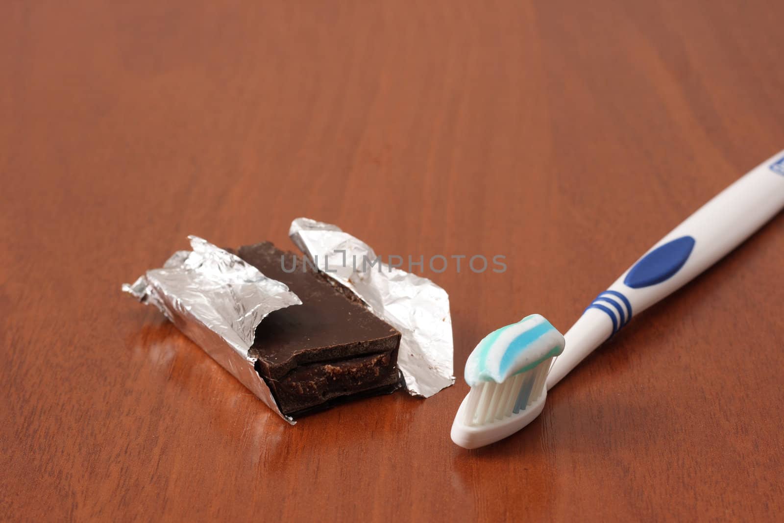 tooth brush next to chocolate