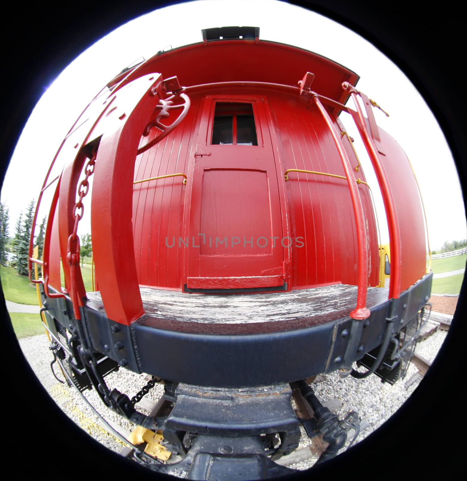 Red railway car through fish eye