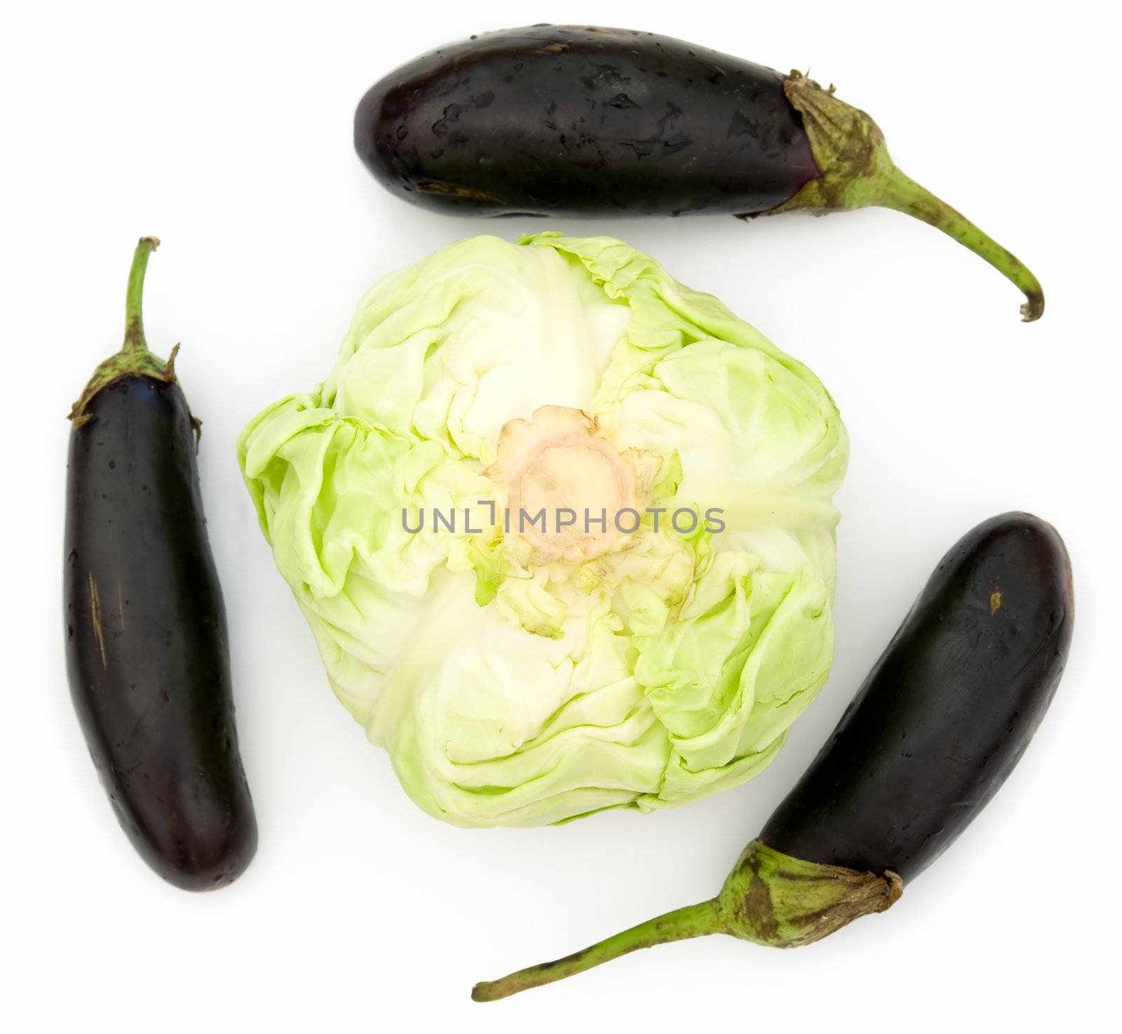 heads of cabbage and three eggplants on a white background.
