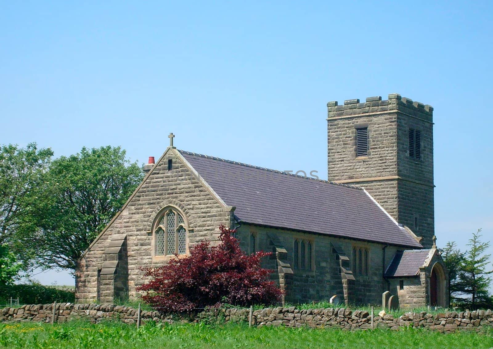 Church in countryside scene, Yorkshire Dales, England.