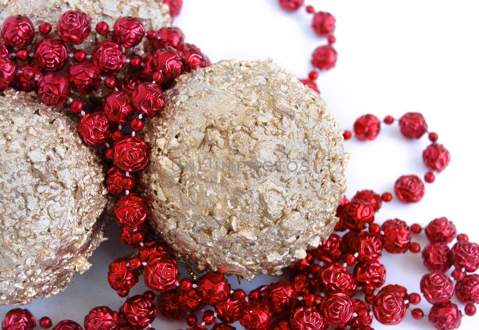 christmas decorations, shiny gold sphere and red garland