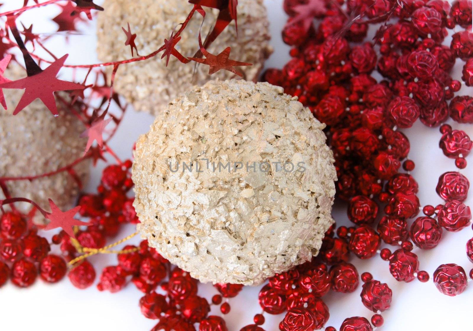 christmas decorations, shiny gold sphere and red garland