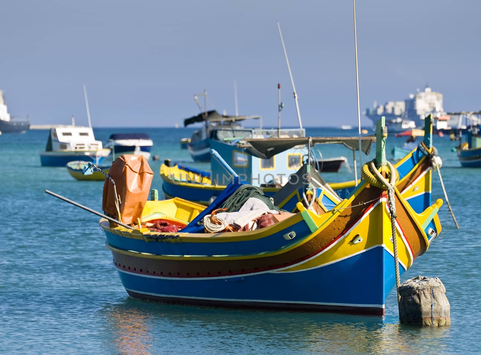 Traditional fishing boats of Malta in the fishing village of Marsaxlokk