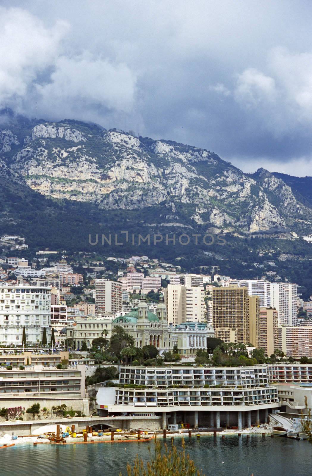 Storm clouds hover over MOnaco, home of the Monaco Grand Prix and the Monte Carlo Casino visible in the background.