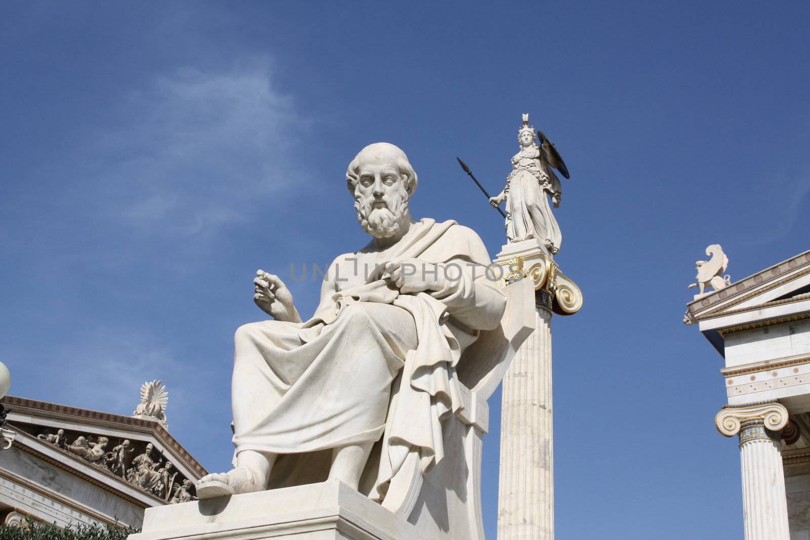 Neoclassical statues of ancient Greek philosopher Plato and goddess Athena outside the Academy of Athens. One of the major landmarks of Athens, Greece.