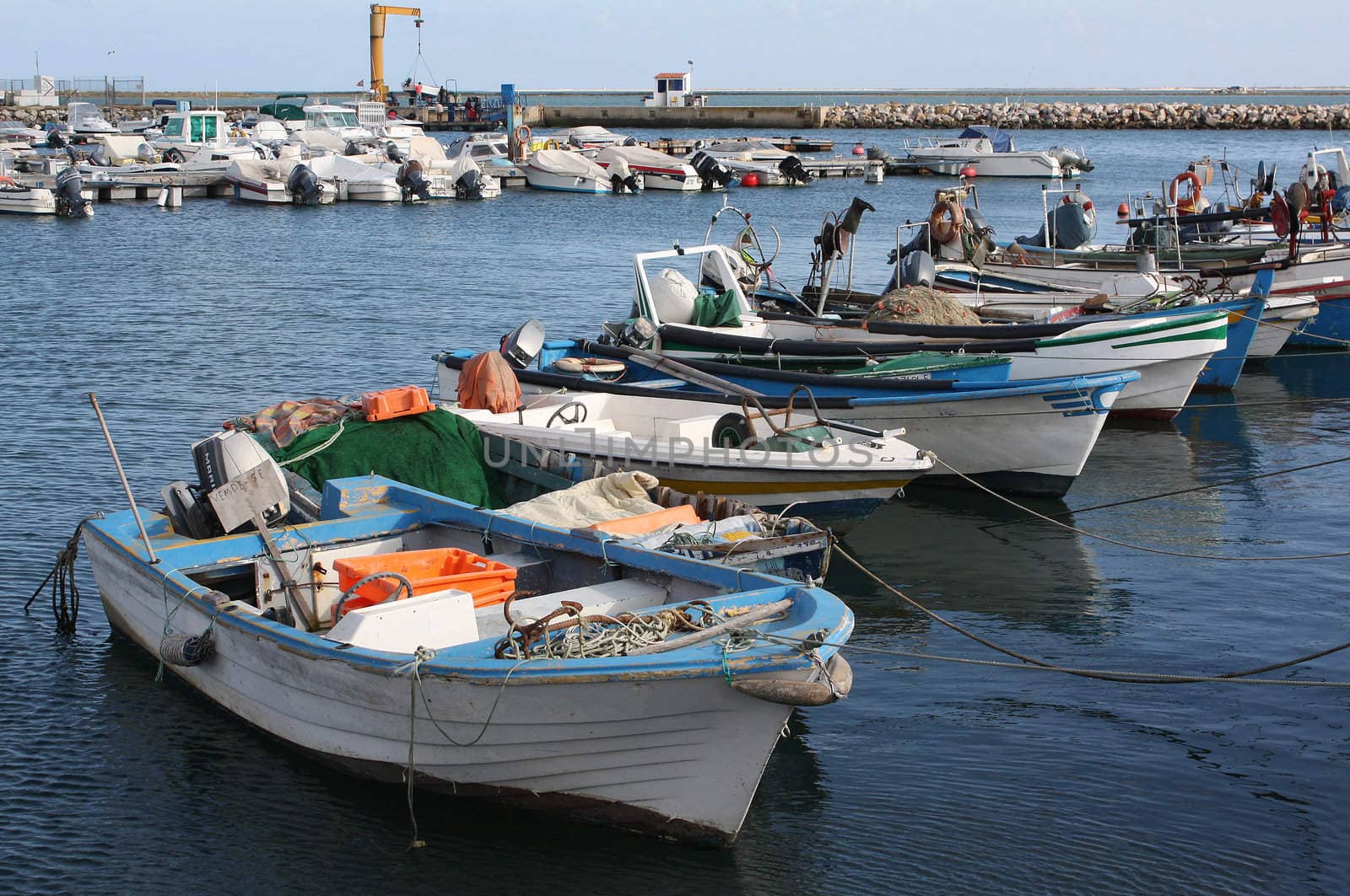 Fishing boats in Olhao's harbour in the Algarve, south coast of Portugal.