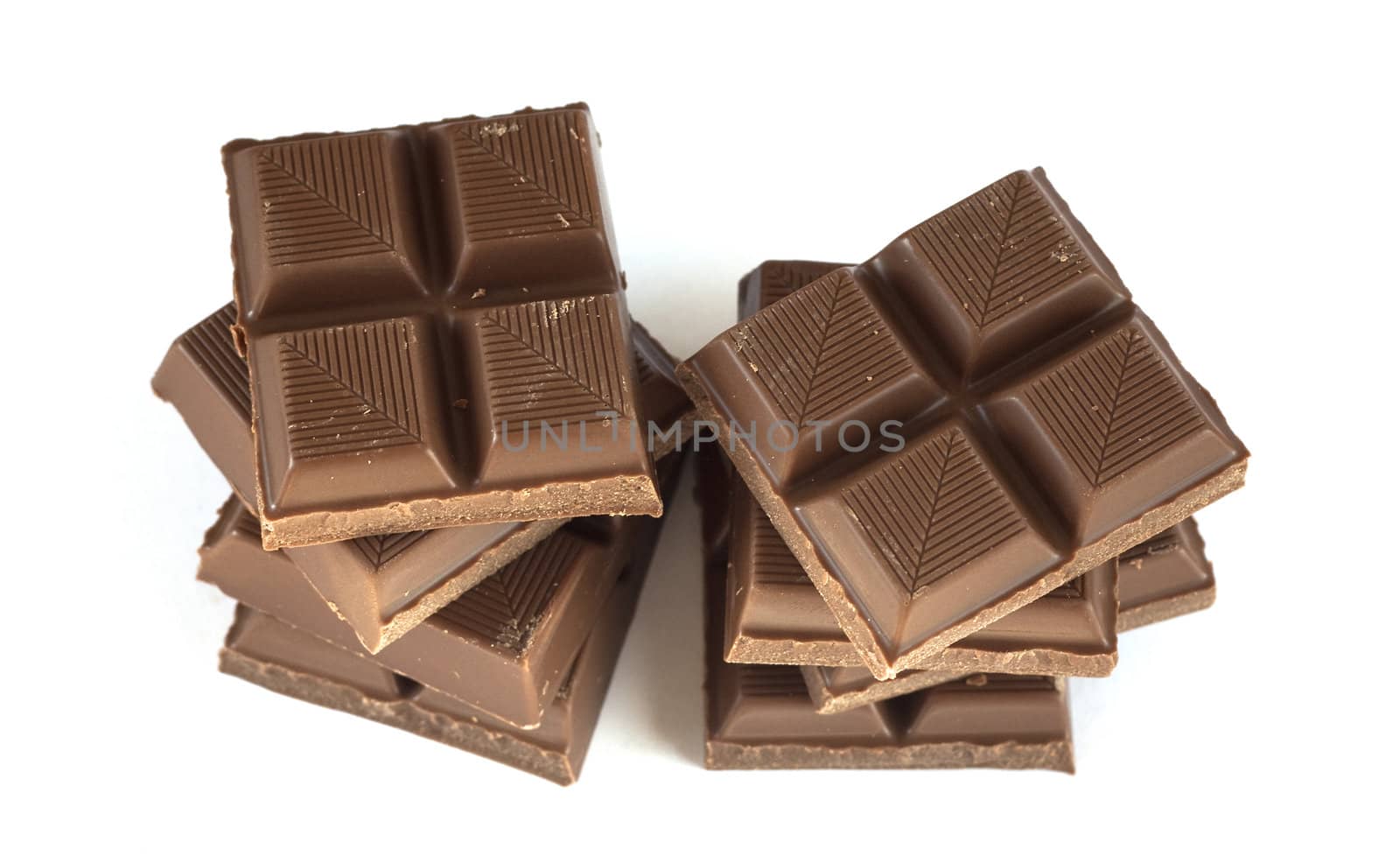 Towers of chocolate isolated over a white background.