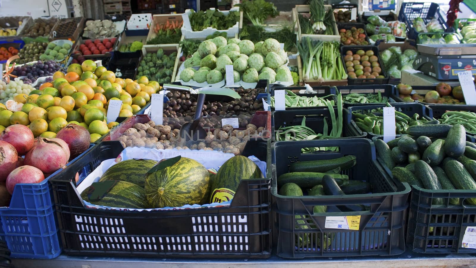 Fruit and vegetables on display on a stand in a Spanish open-air market.