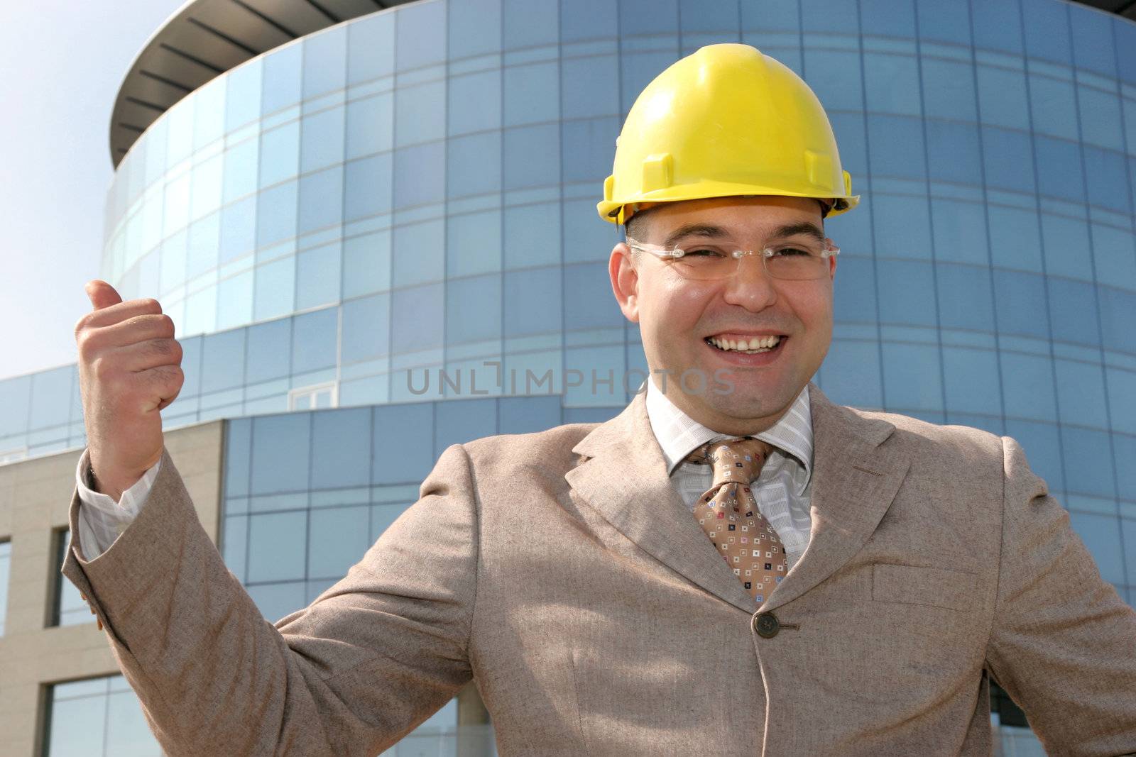 Successful businessman with helmet 