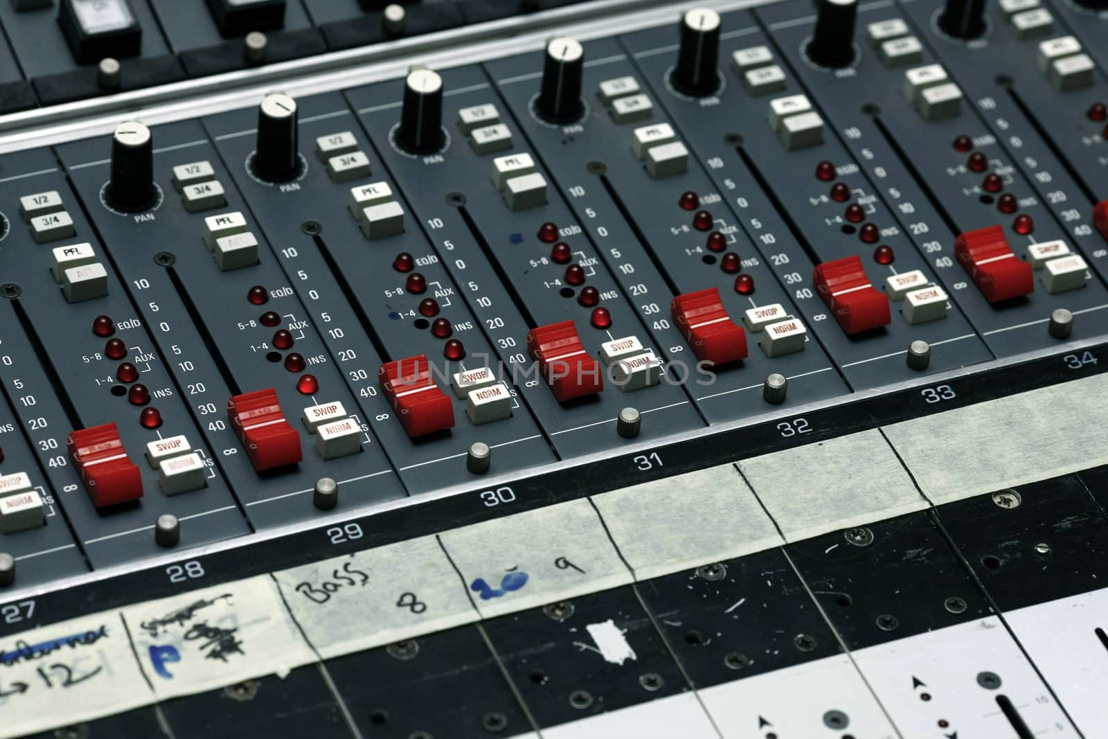 Detail of a mixing board in a recording studio - This is shot in a real studio  with selective focus
