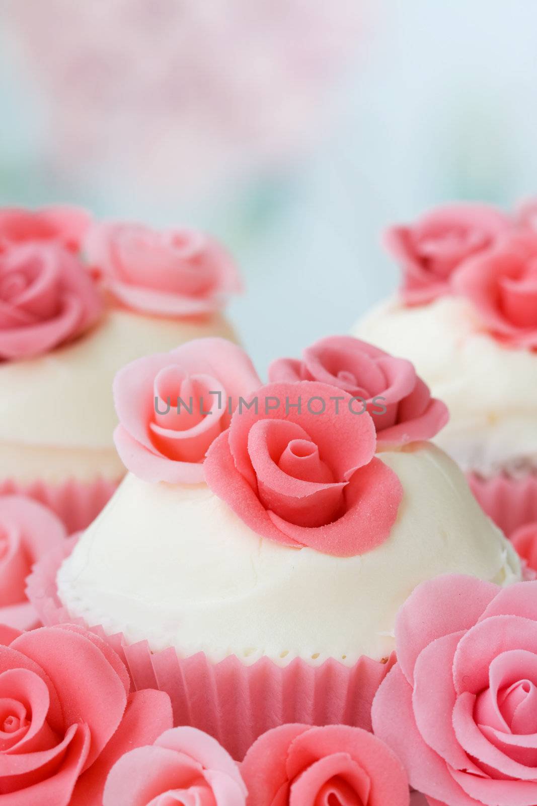 Cupcakes decorated with pink sugar roses