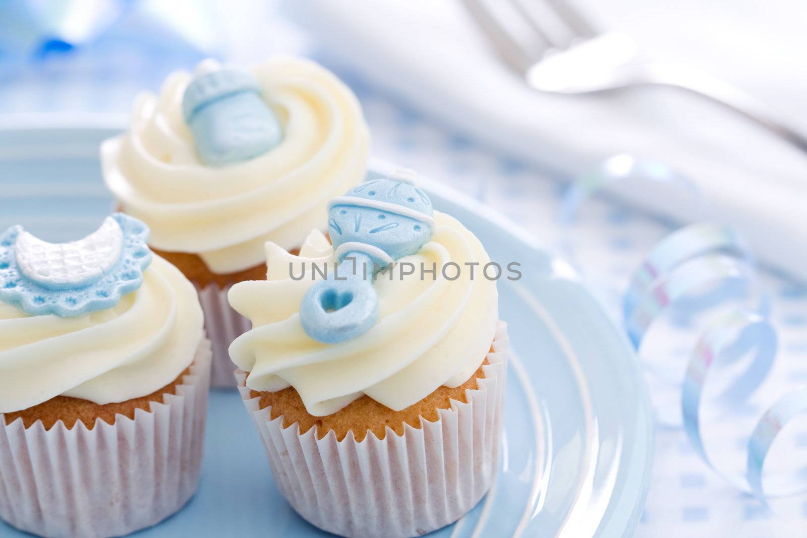 Cupcakes decorated with a baby shower theme