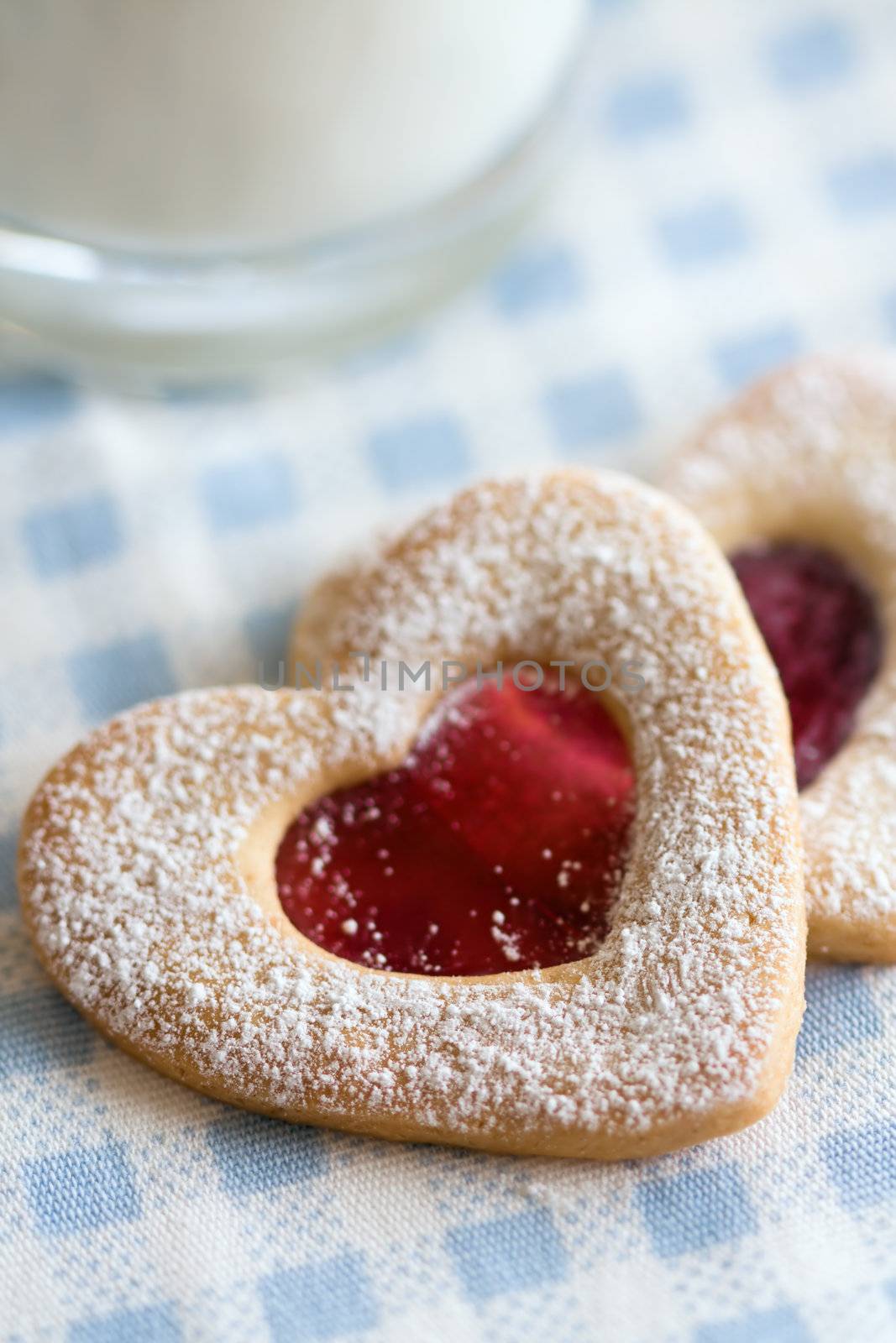 Home made valentine cookies with a glass of milk