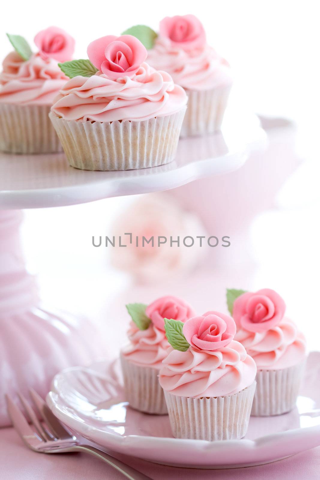Rosebud cupcakes served on a pink cakestand