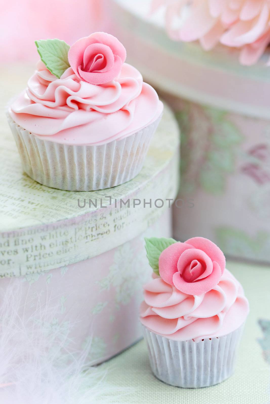Cupcakes decorated with pink sugar roses