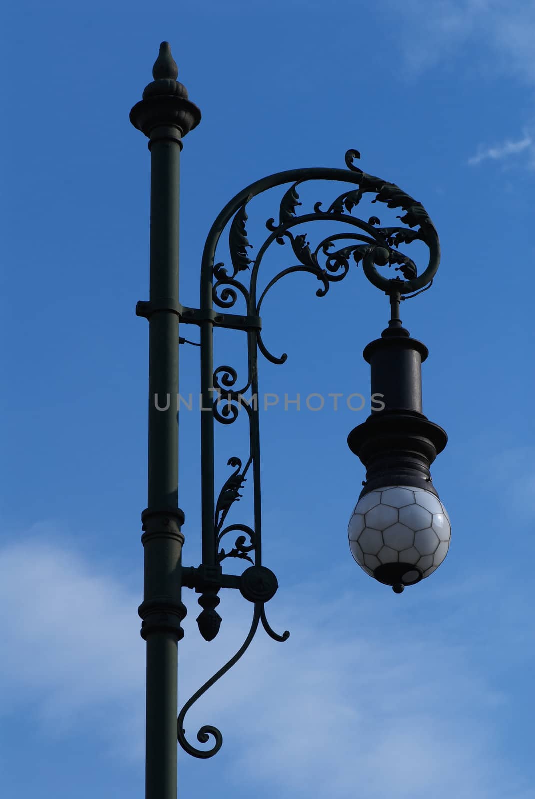 Photo of a street lantern on a background of the blue sky