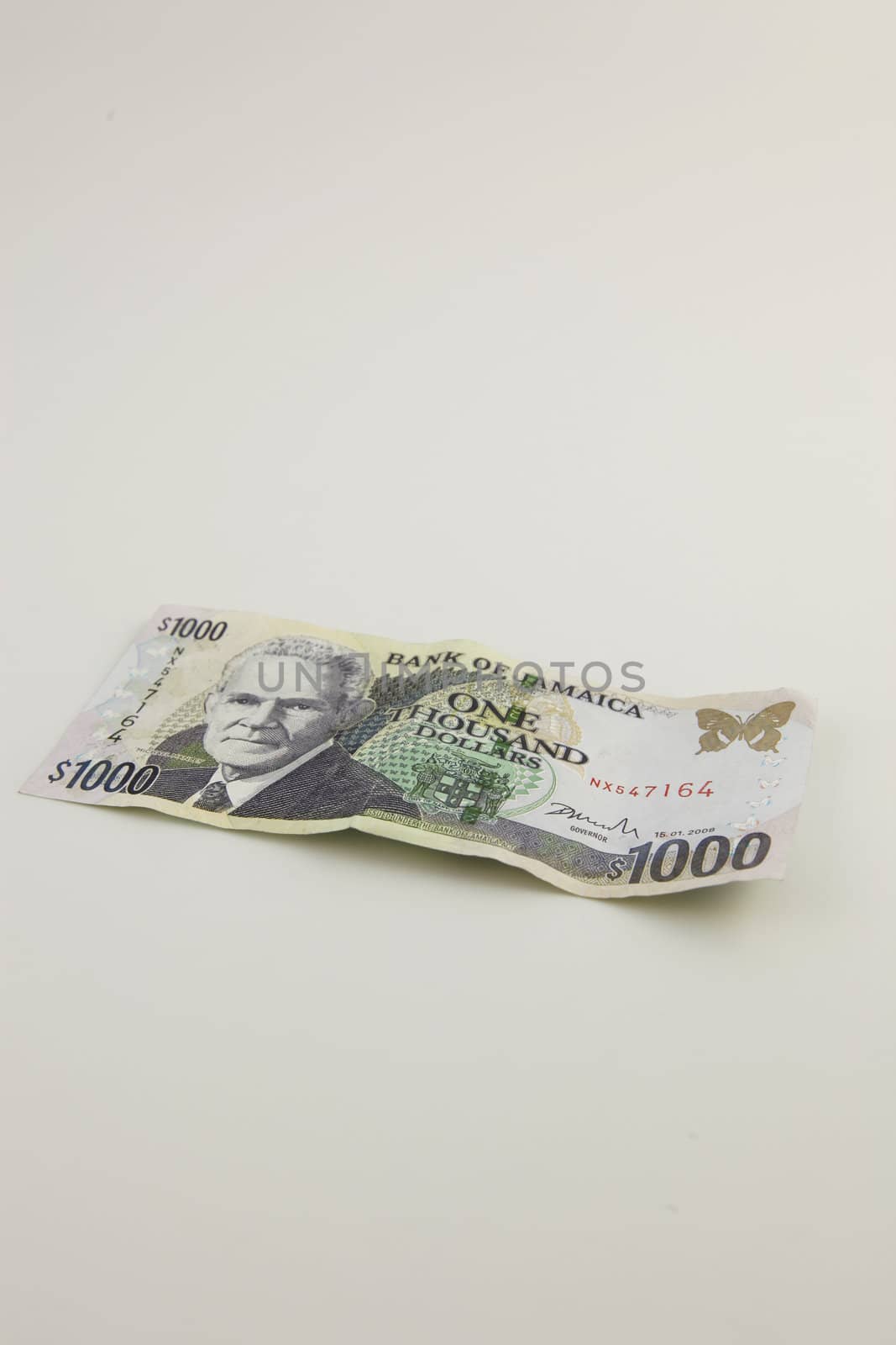 A one thousand Jamaican dollar bill with a white background