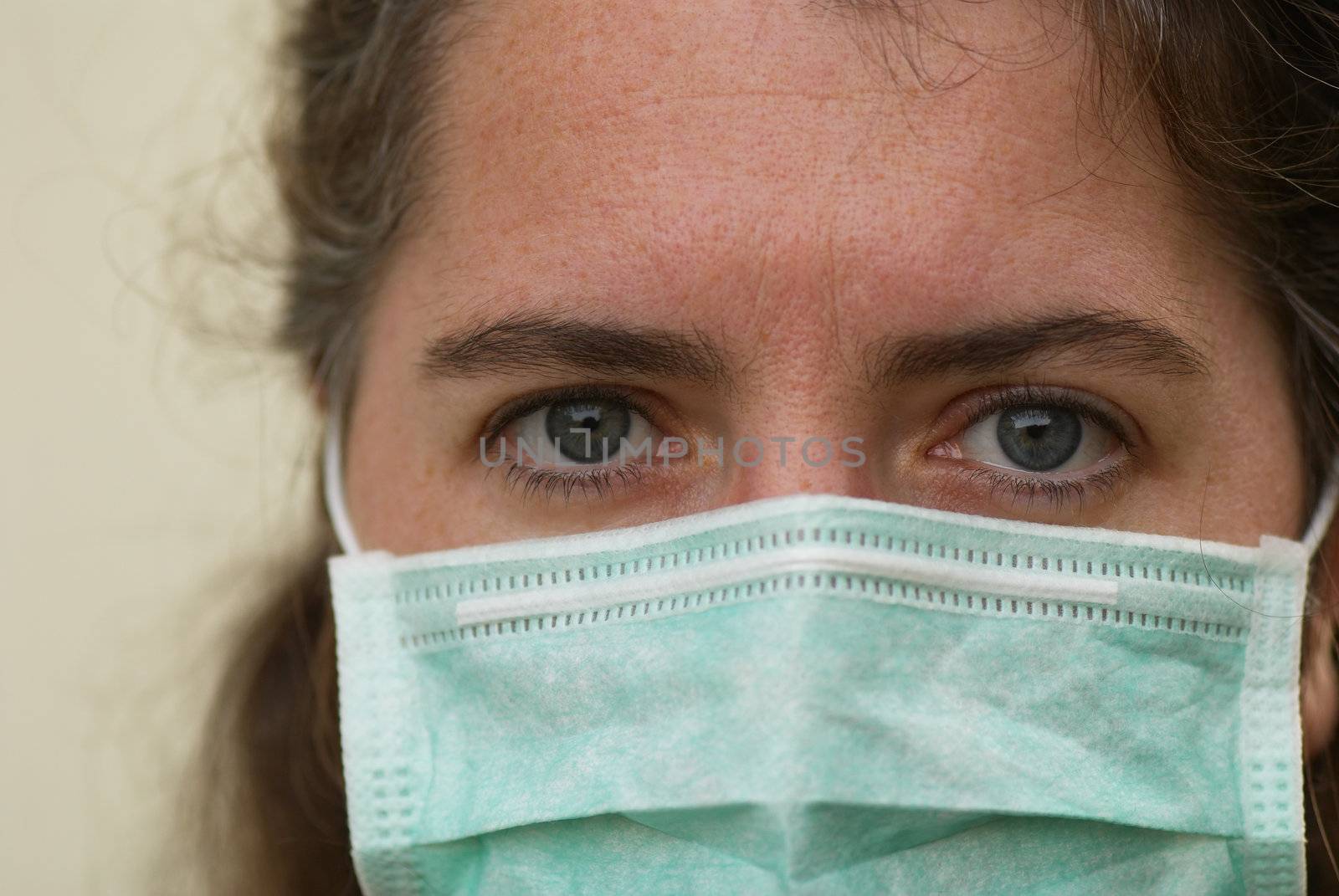 Female doctor with her face mask on.