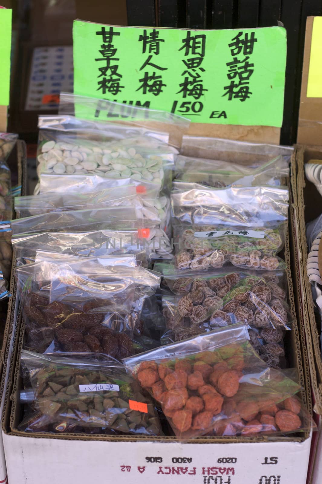 A shot of a market stall selling oriental plum candies in China Town.