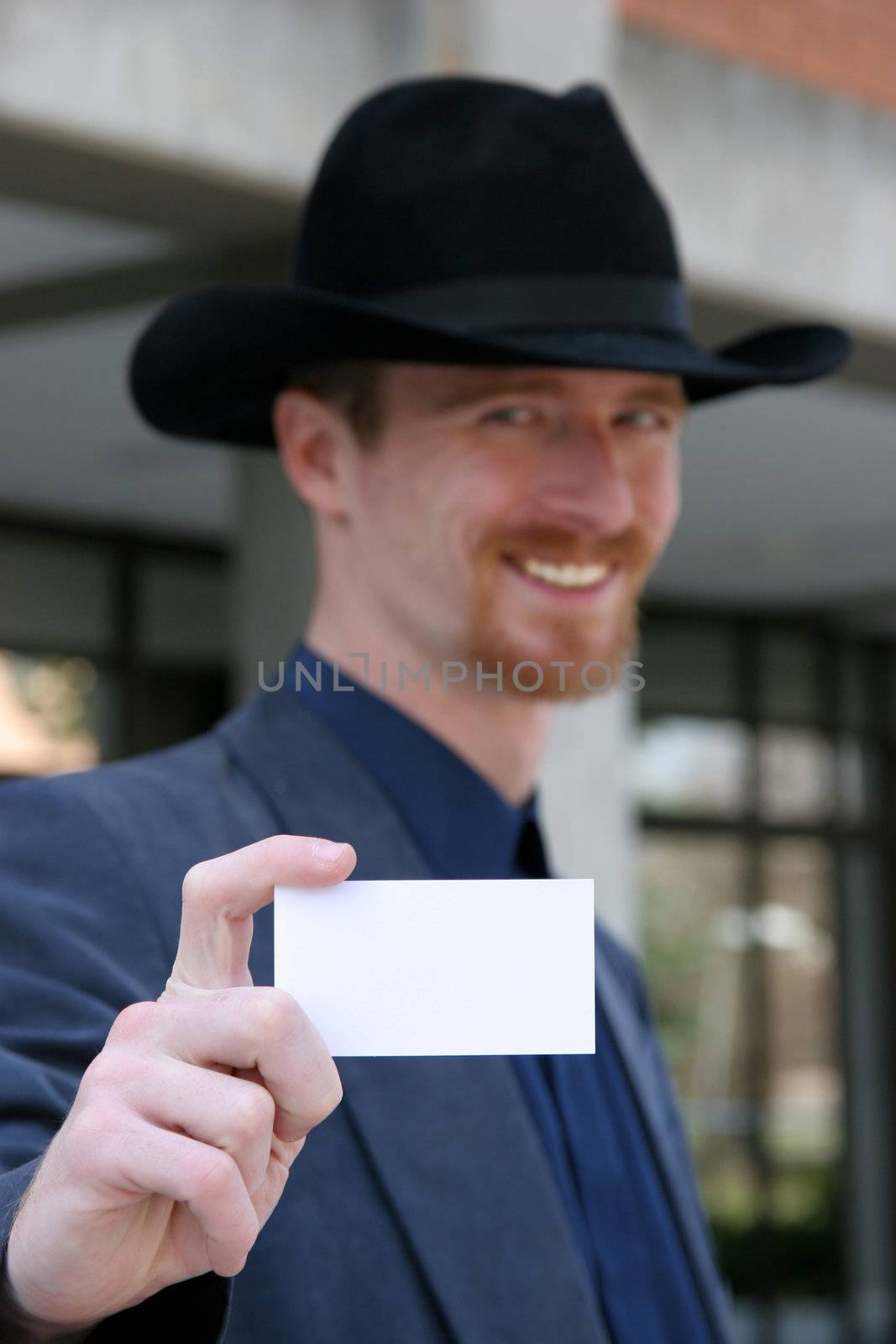 Businessman holding calling card