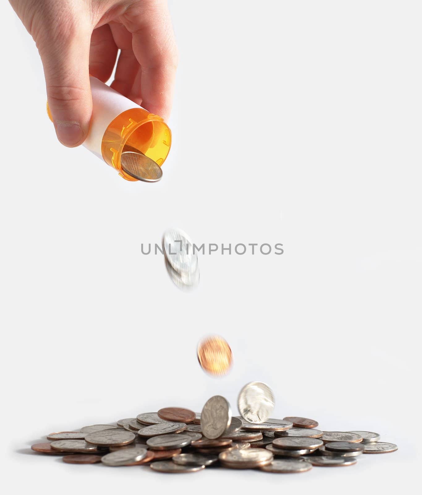 Coins falling from RX bottle against white background.
