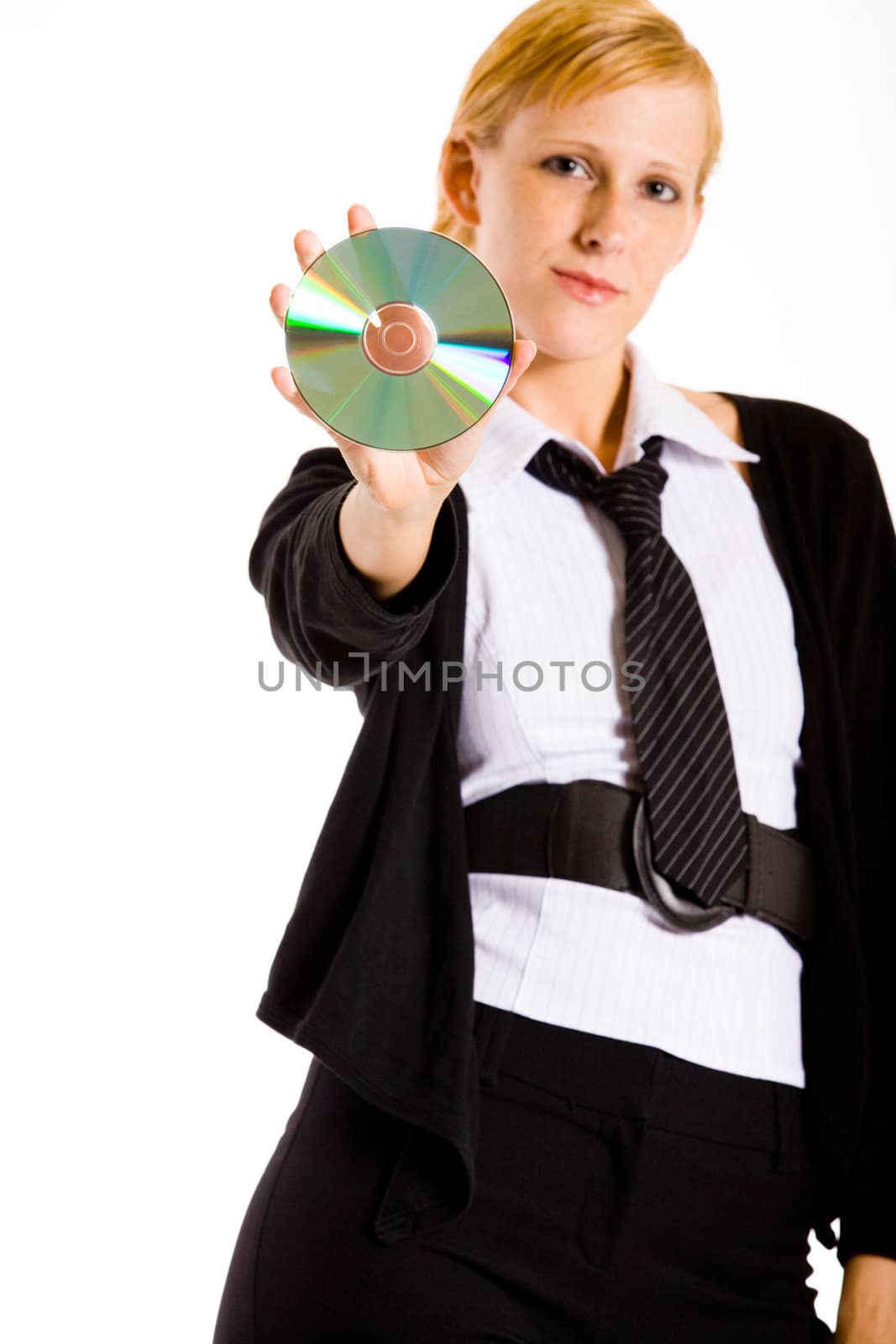 Friendly business woman presenting a compact disk. Focus is on the CD