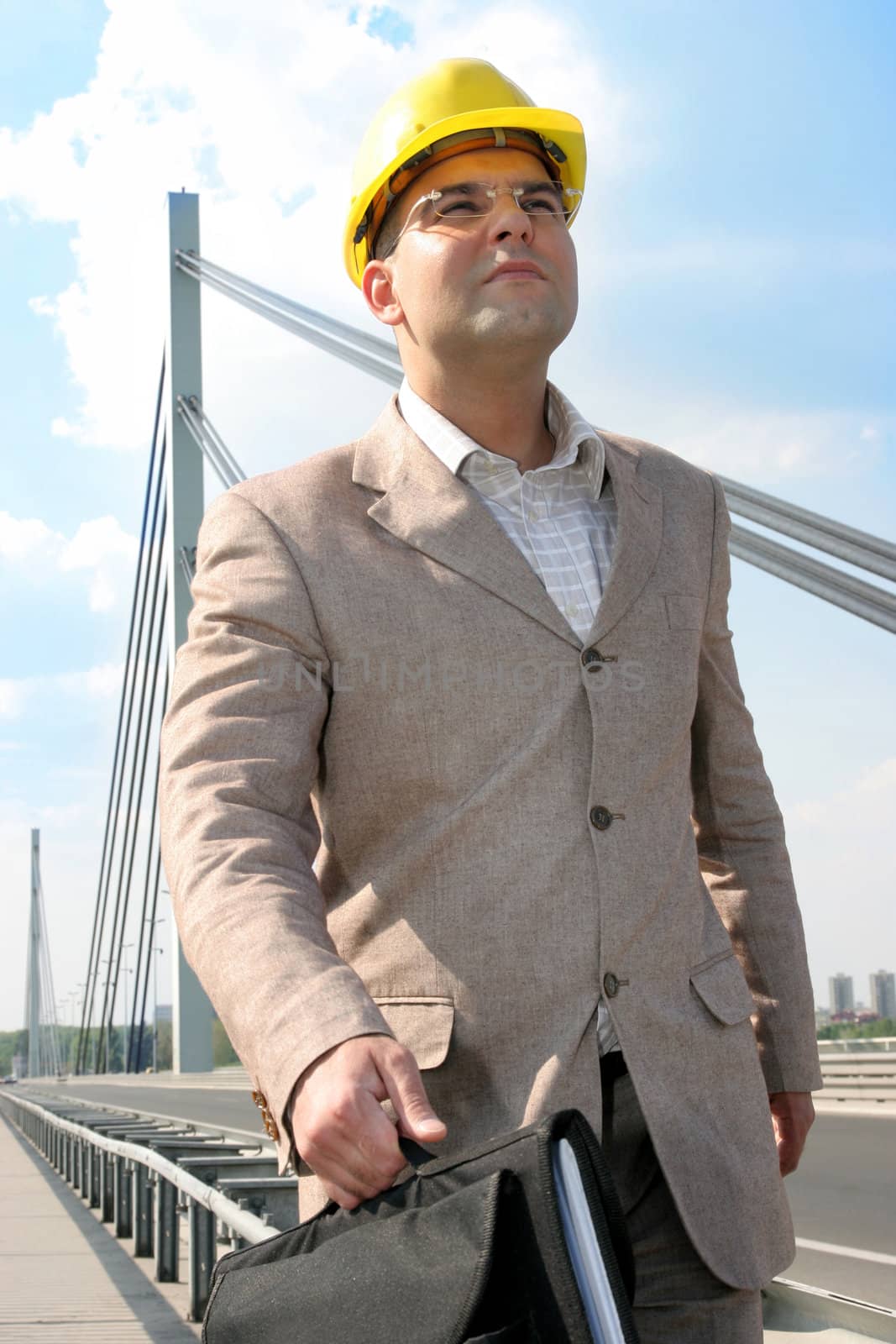 Businessman walking to work over bridge