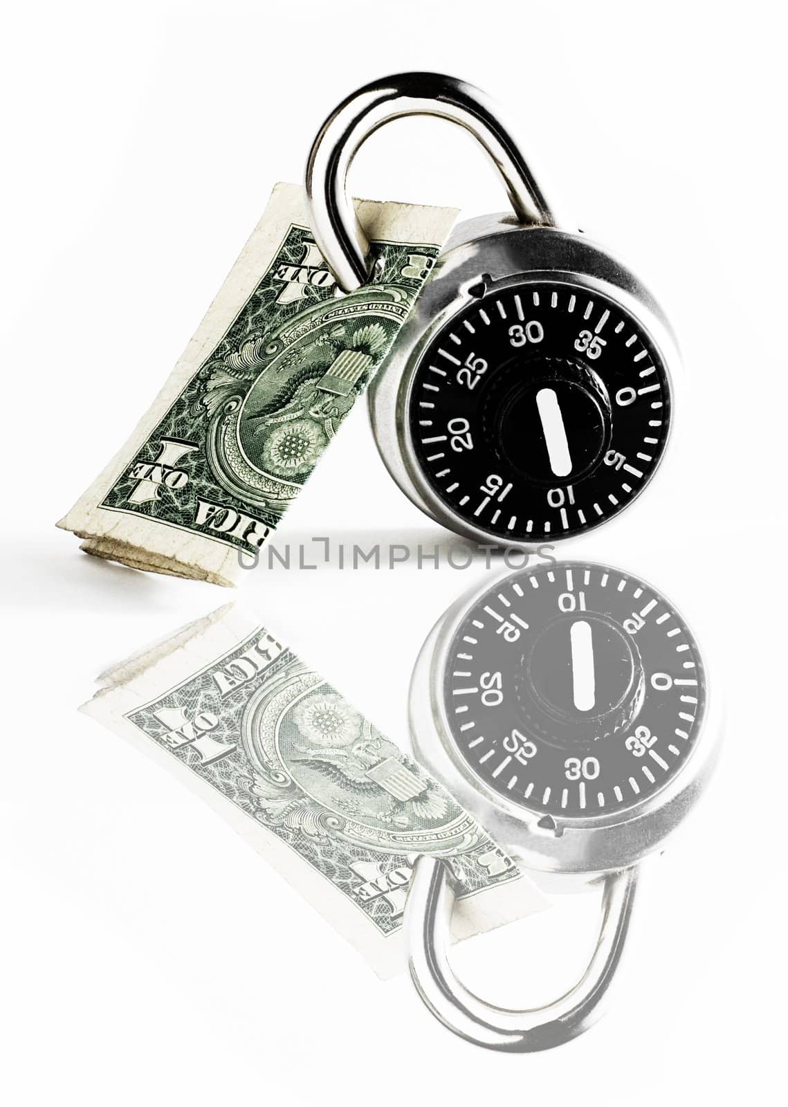 Dollar bill locked by combination lock on white background with reflection.