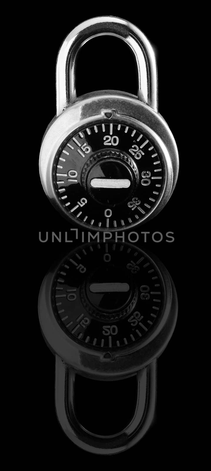Combination lock on black background with reflection.