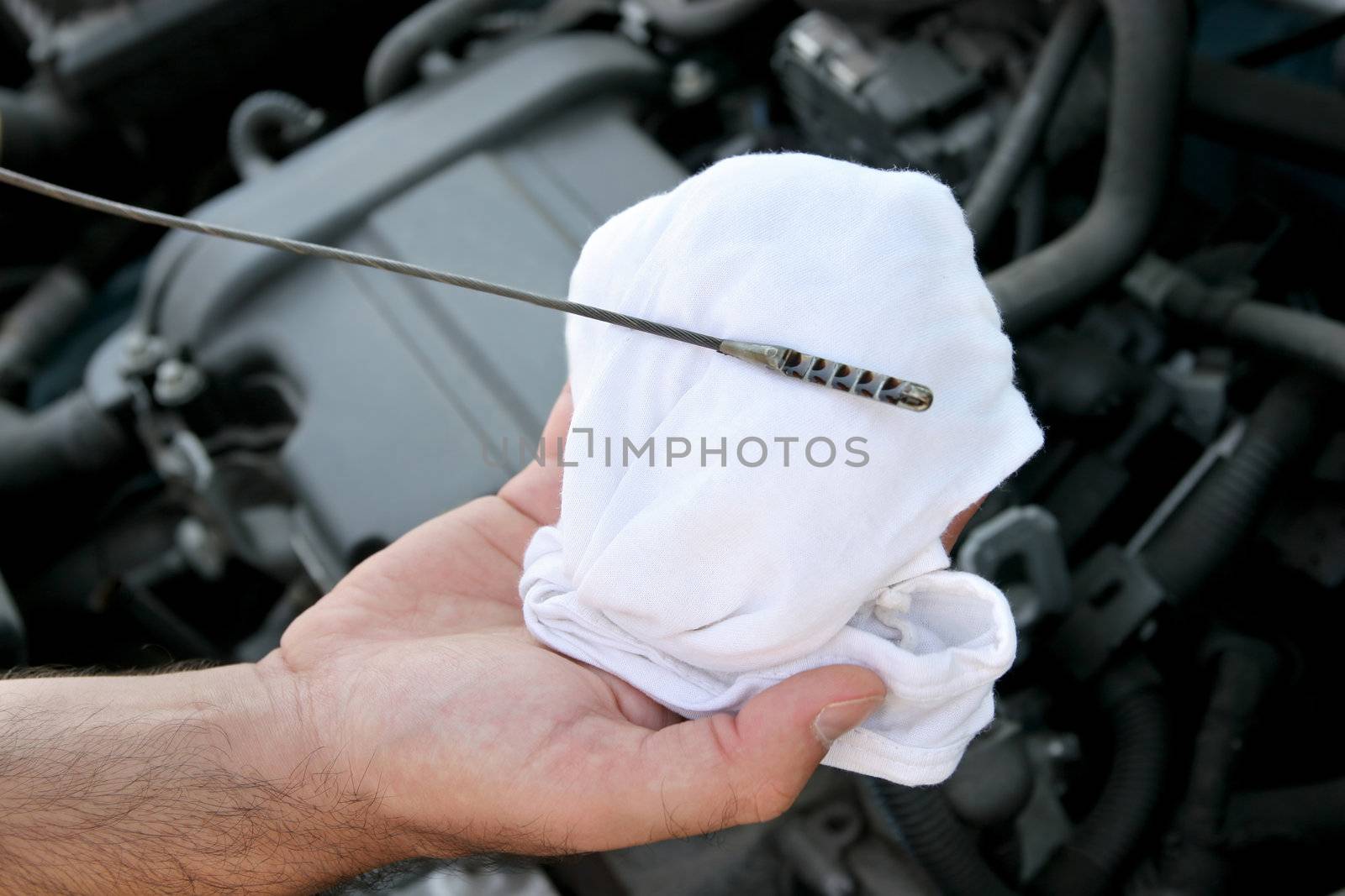 Details checking engine oil dipstick in car