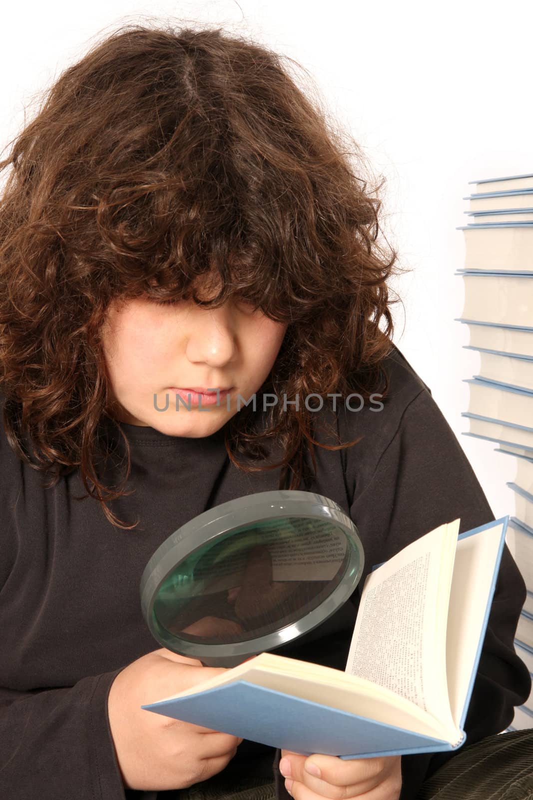 boy reading a book with lens on white background