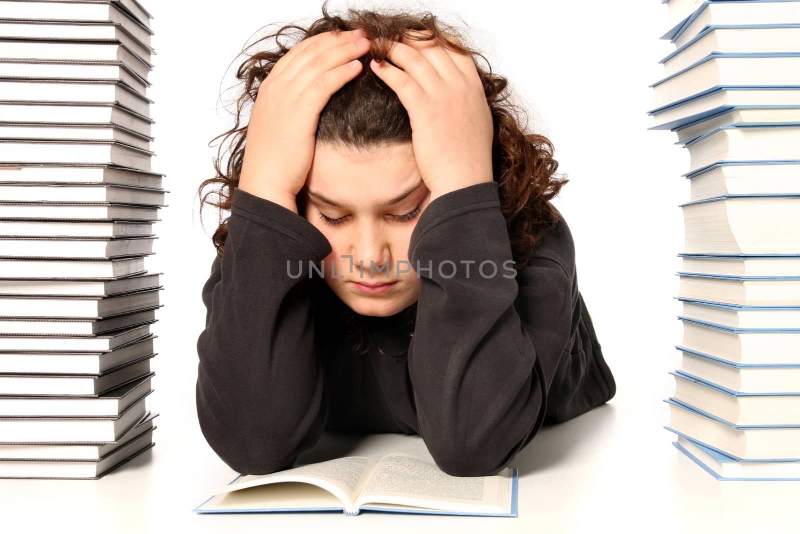 boy unhappy and many books on white background