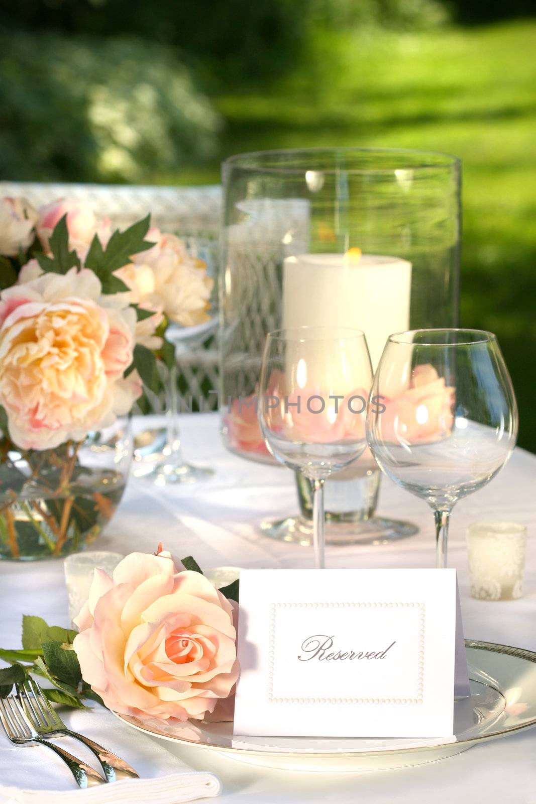 Place setting and card on a table at a wedding reception 