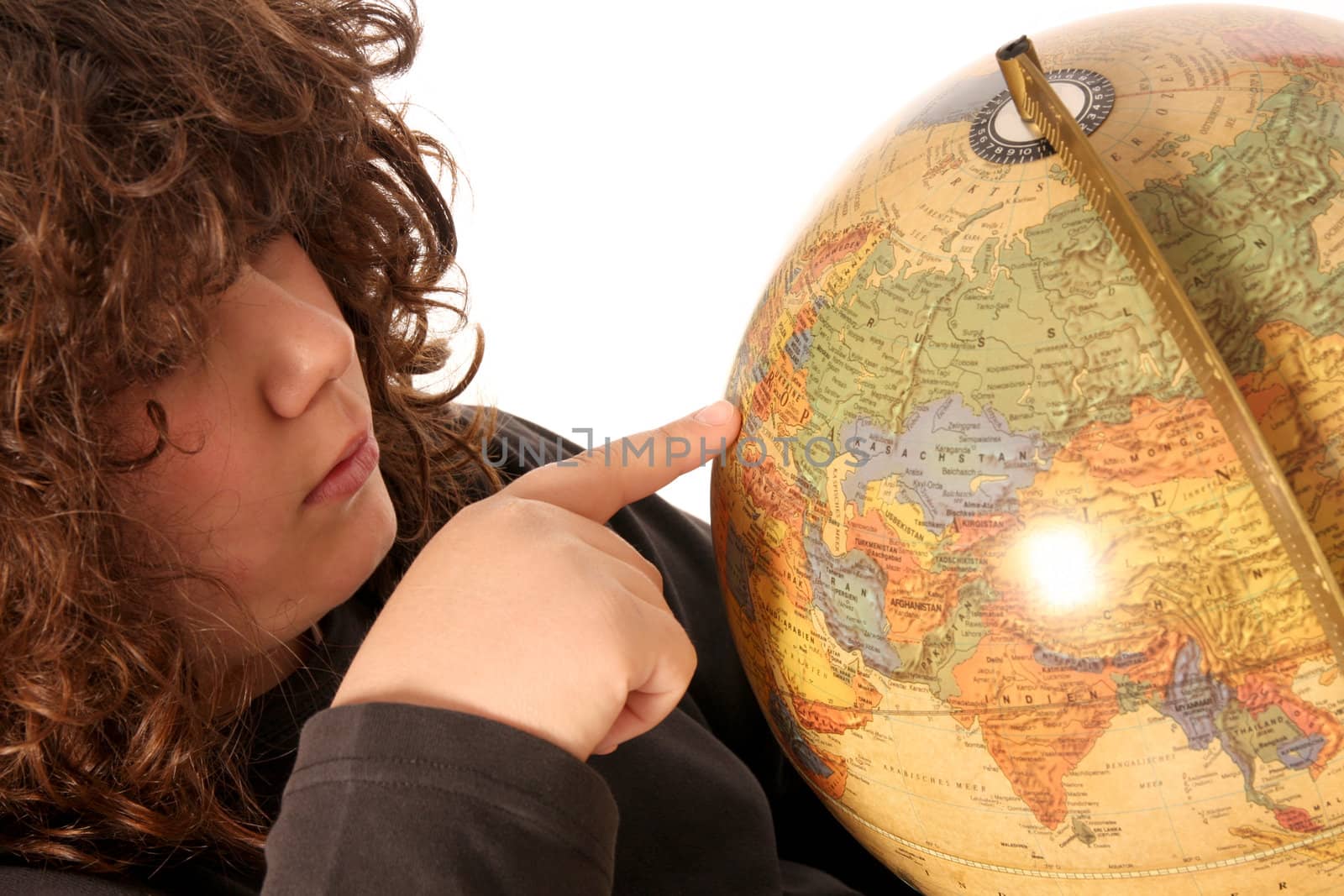 boy finger pointing on world globe in isolated