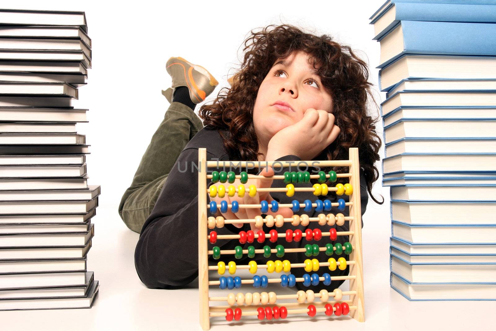 boy with abacus calculator with colored beads and books