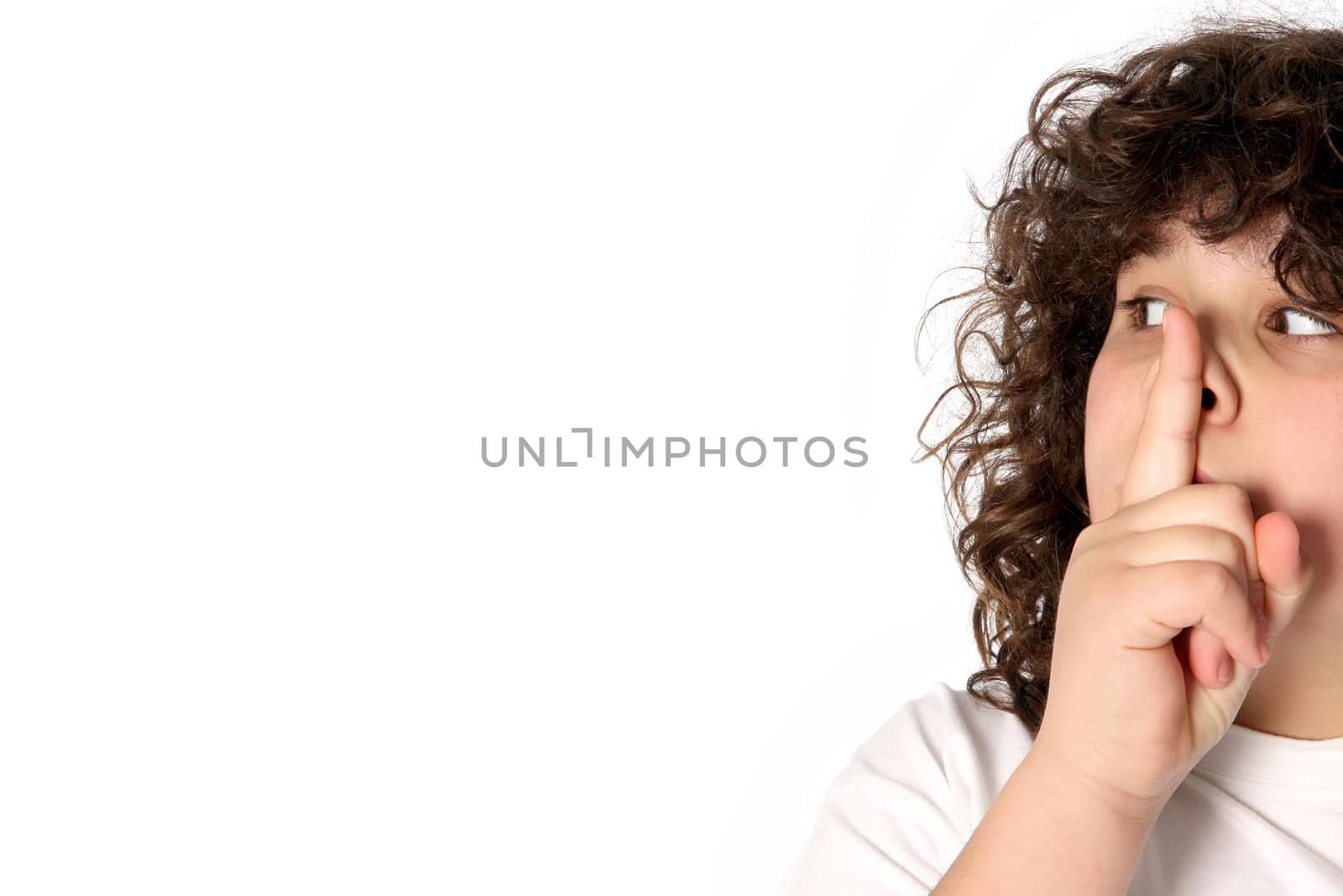 boy gestures for silence on white background